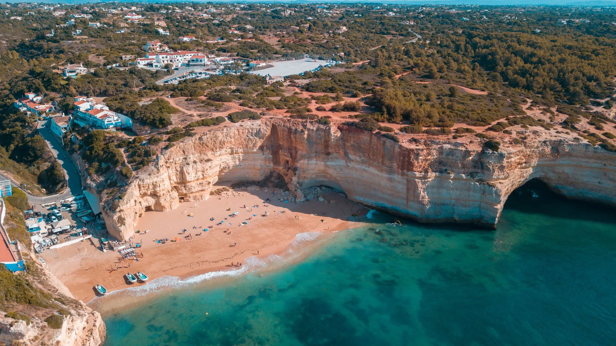 Cliff-lined beach in the Algarve (illustrative photo of the destination, not the resort)